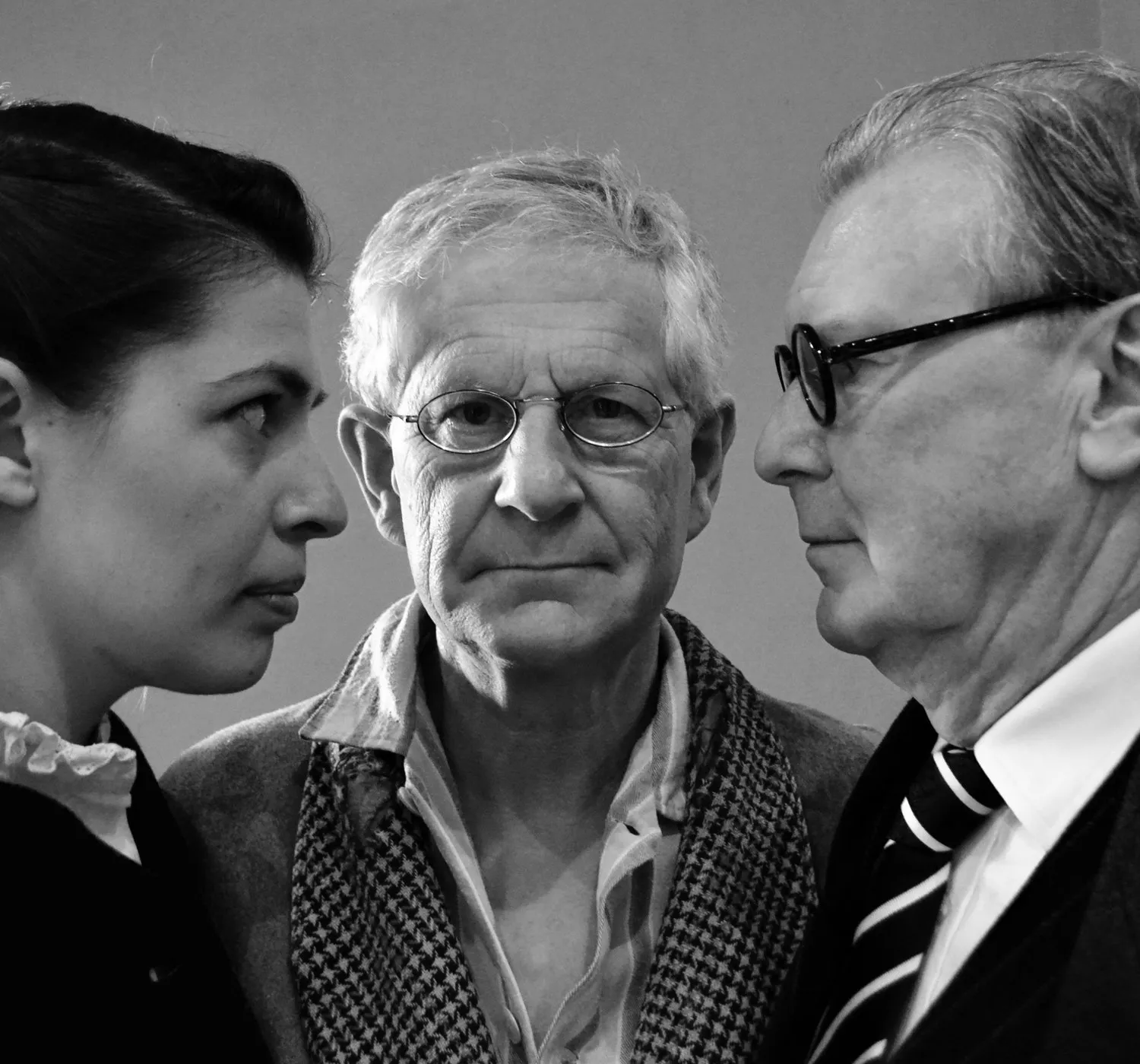 Peter G Pearson centre stage in Regulation 18B: No Free Man, flanked by two fellow actors in a black-and-white production photograph